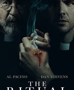 A tense scene from The Ritual (2025) showing Al Pacino as Father Riesinger confronting a possessed woman in a dimly lit room, capturing the film’s eerie and suspenseful atmosphere.